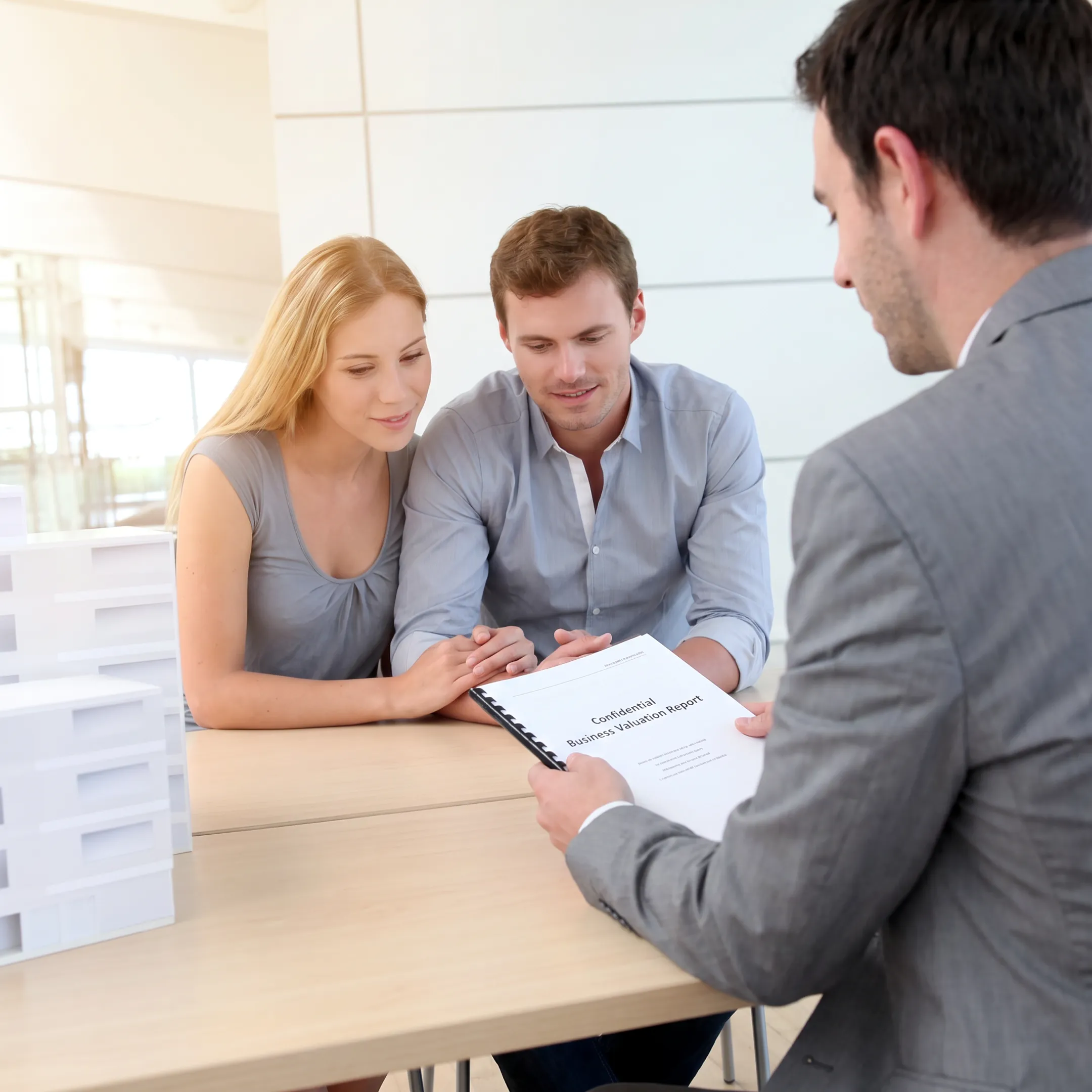 Advisor presenting a confidential printing business valuation to an owner