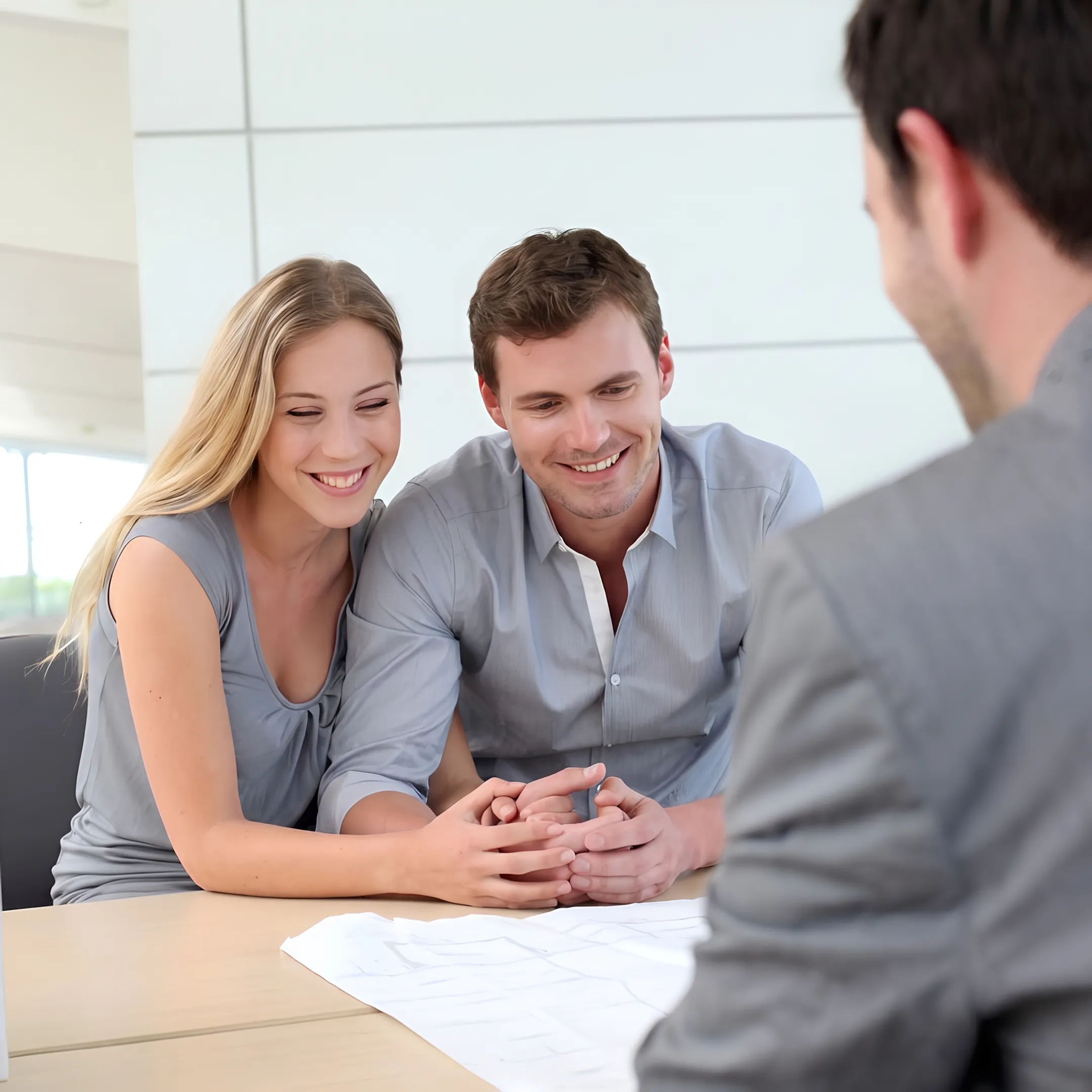 Business broker reviewing commercial gas station financial documents with a client