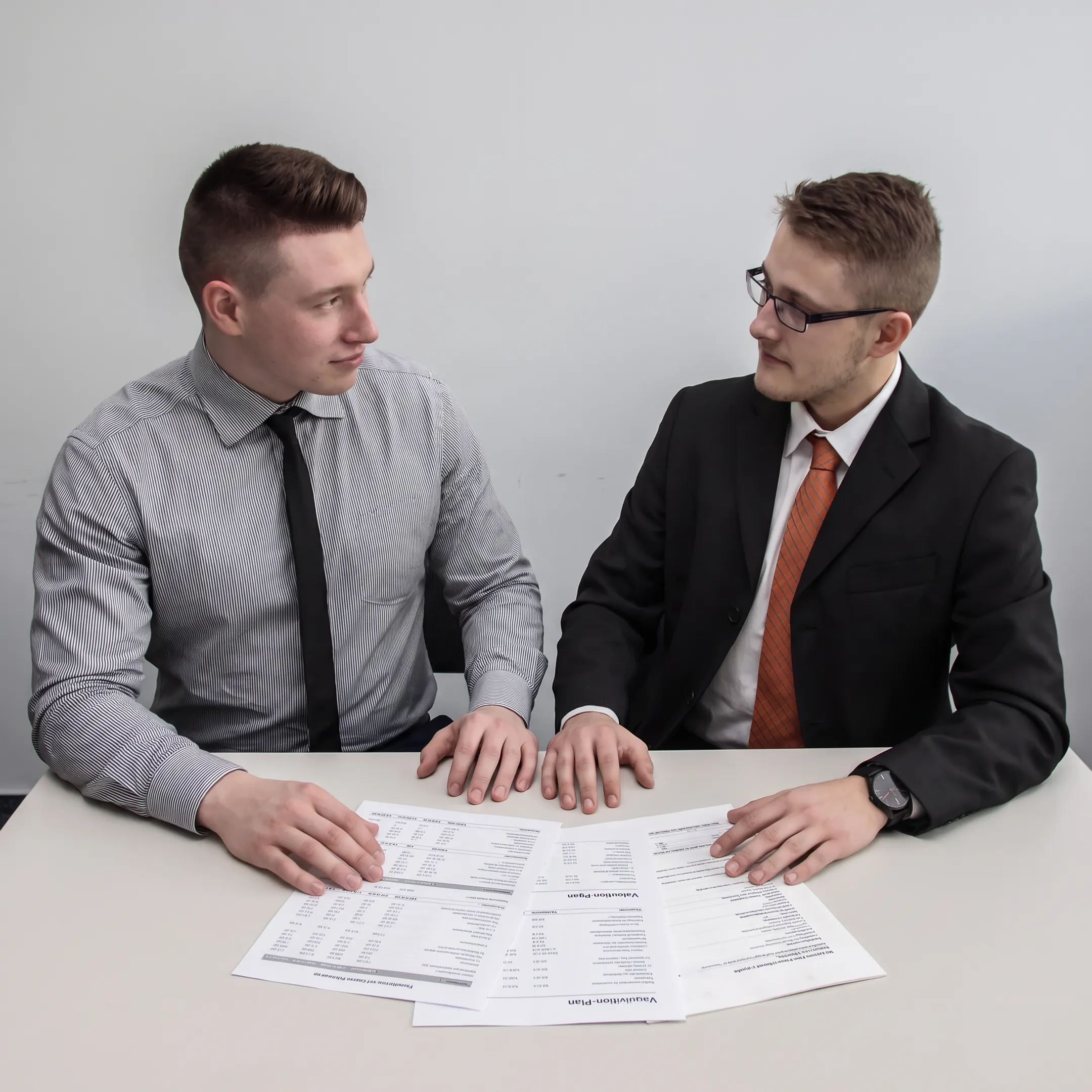 Business broker reviewing gym financial documents with a fitness business owner