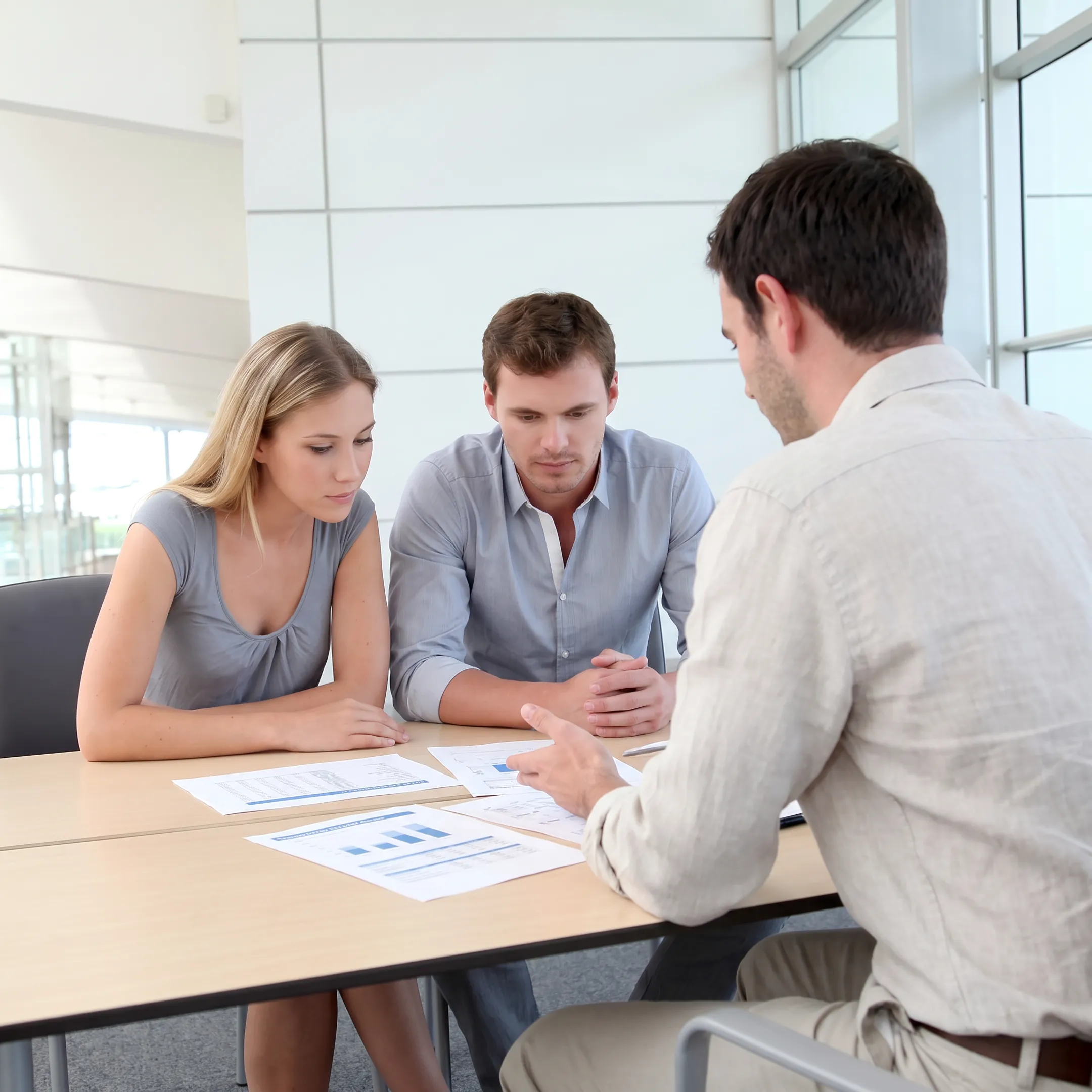 Advisor explaining business valuation findings to a client