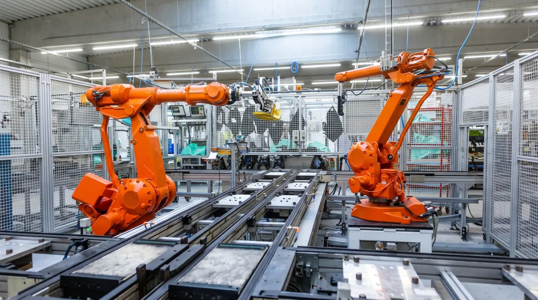Industrial robot arm performing precision assembly on modern manufacturing production line