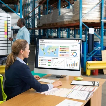 Freight manager reviewing shipment dashboard