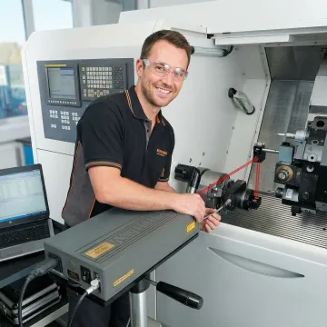 CNC machine undergoing precision laser calibration testing