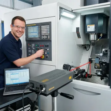 Precision CNC machining equipment being calibrated with laser interferometer