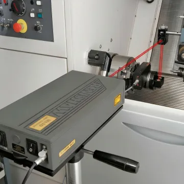Precision laser interferometer measuring CNC machine accuracy in Oregon manufacturing facility