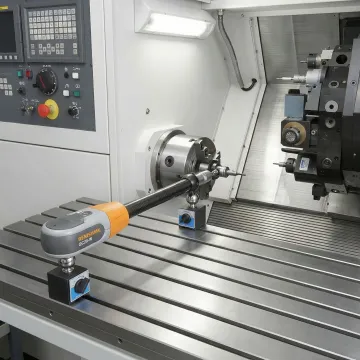 Close-up of ballbar measurement device attached to CNC machine spindle