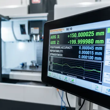 CNC machine calibration measurement system displaying precision accuracy data