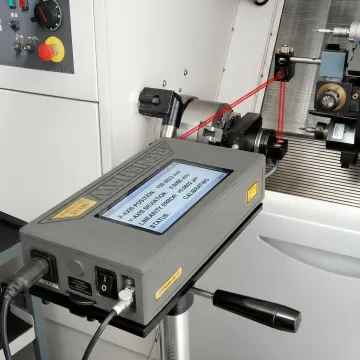 NIST-traceable laser measurement equipment calibrating CNC machine axis