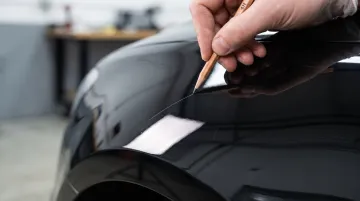 Pencil hardness testing tool used on coated automotive paint surface