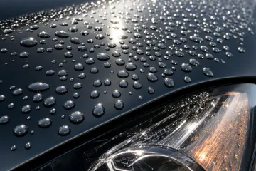 Close-up of glossy ceramic-coated car exterior with water beading