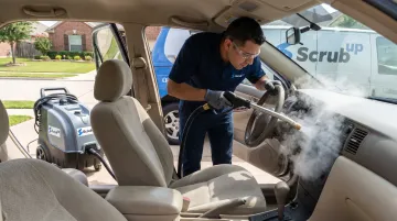 ScrubUp technician performing mobile steam wash on car interior