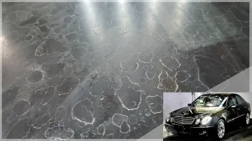 Car paint surface showing UV oxidation damage and mineral water spot etching