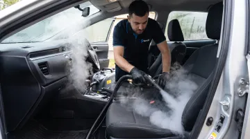 ScrubUp technician steam cleaning car interior vents and seats