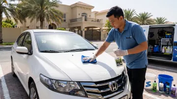 Mobile car wash technician performing eco-friendly ceramic coating safe wash