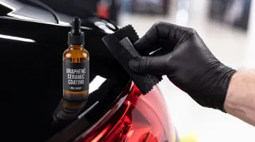 Graphene ceramic coating being applied to car paint surface