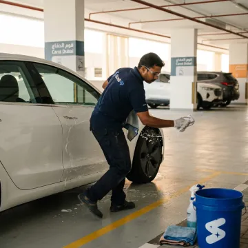 Tesla being detailed by a mobile technician in Dubai