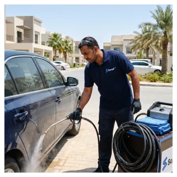 Car detailing products beside a polished vehicle