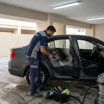 Mobile car cleaning technician deep cleaning a vehicle interior