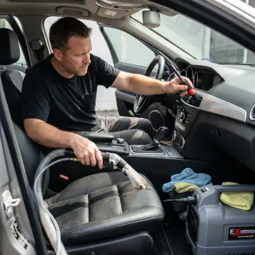 Technician detailing a car interior