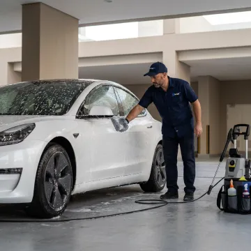 Tesla receiving mobile car wash service in Dubai