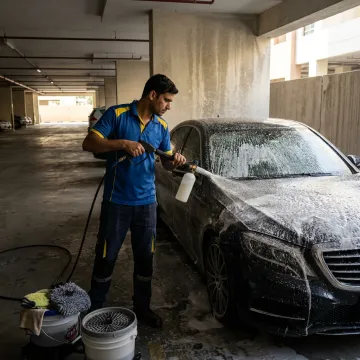 Technician detailing a car in Dubai