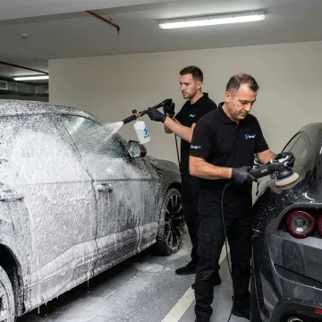 Sport vehicle being washed and polished in Dubai