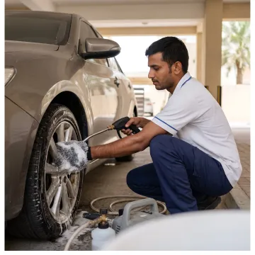 Mobile technician cleaning and shining car tyres