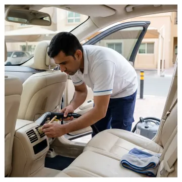 Technician detailing a car interior