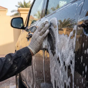 Foam wash cleaning a vehicle exterior