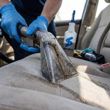 Car upholstery extraction cleaning in progress