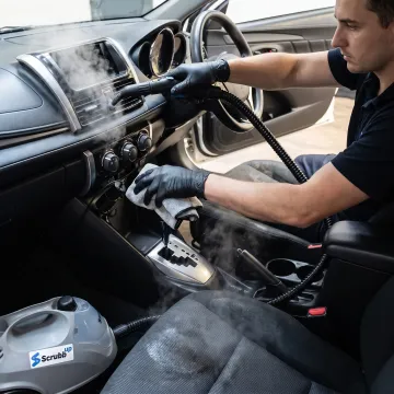 Steam cleaning car dashboard and upholstery