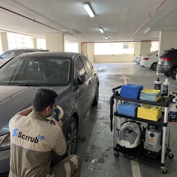 Mobile technician detailing a polished car