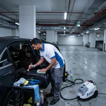 Technician performing mobile car detailing