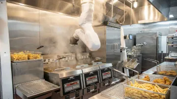 Commercial kitchen cooking robot automating fry station food preparation tasks