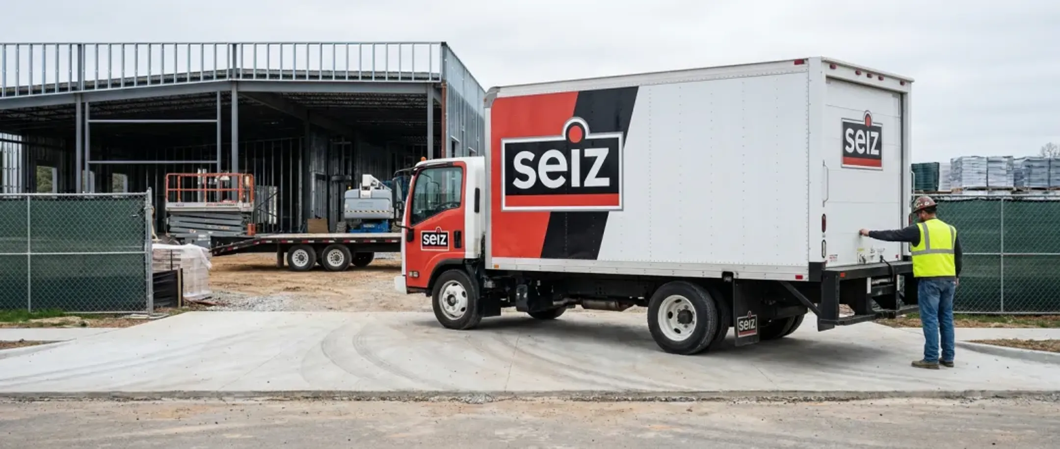 Construction company box truck with branded vehicle wrap