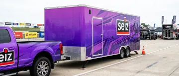Race team trailer purple wrap