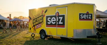 Promotional event trailer with yellow vinyl wrap