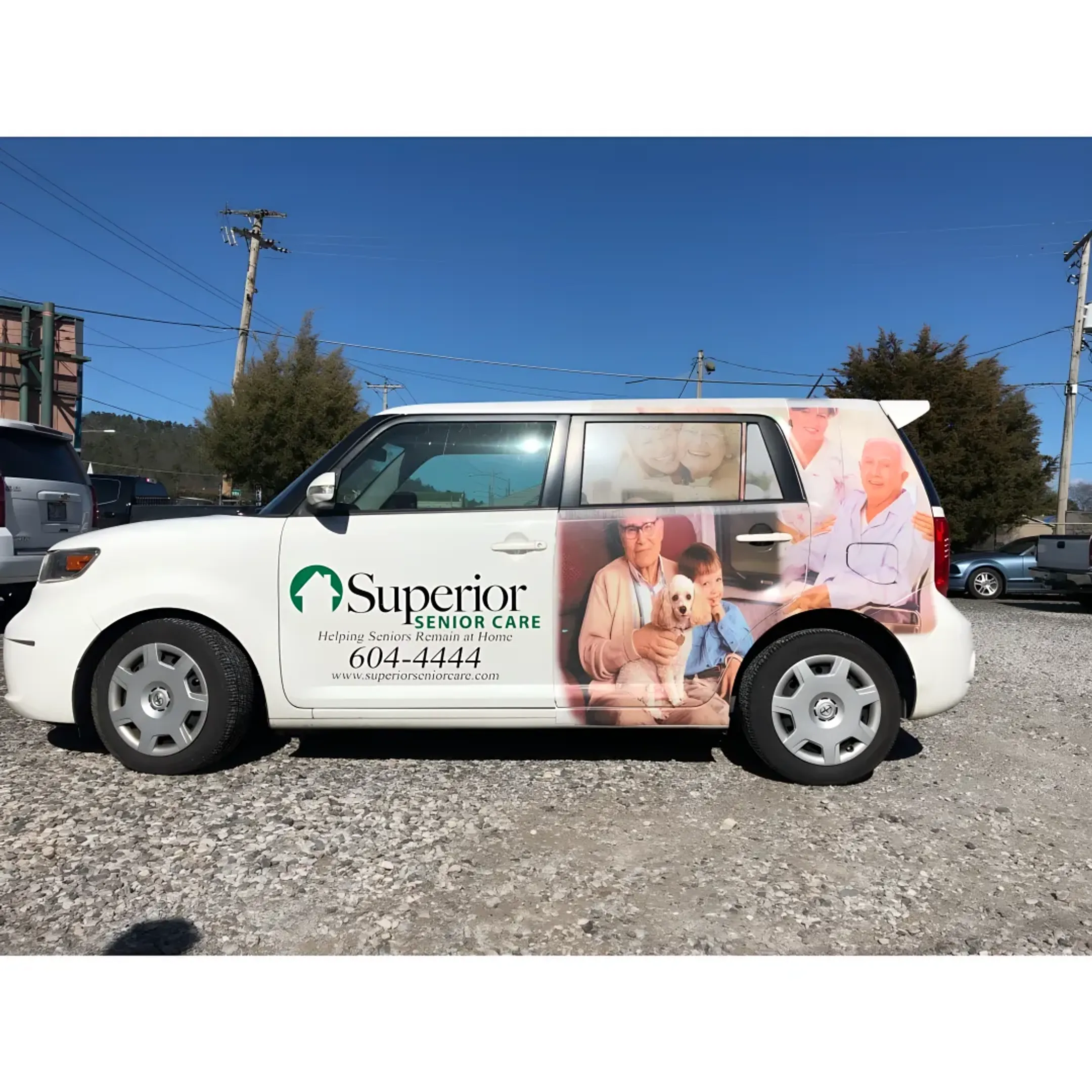 Technician applying a custom vinyl wrap to a commercial vehicle.