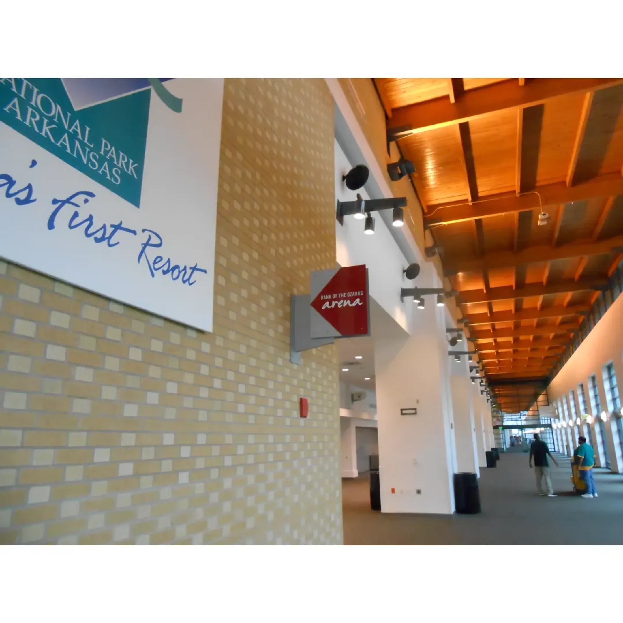 A modern university campus with clear wayfinding signs directing students.