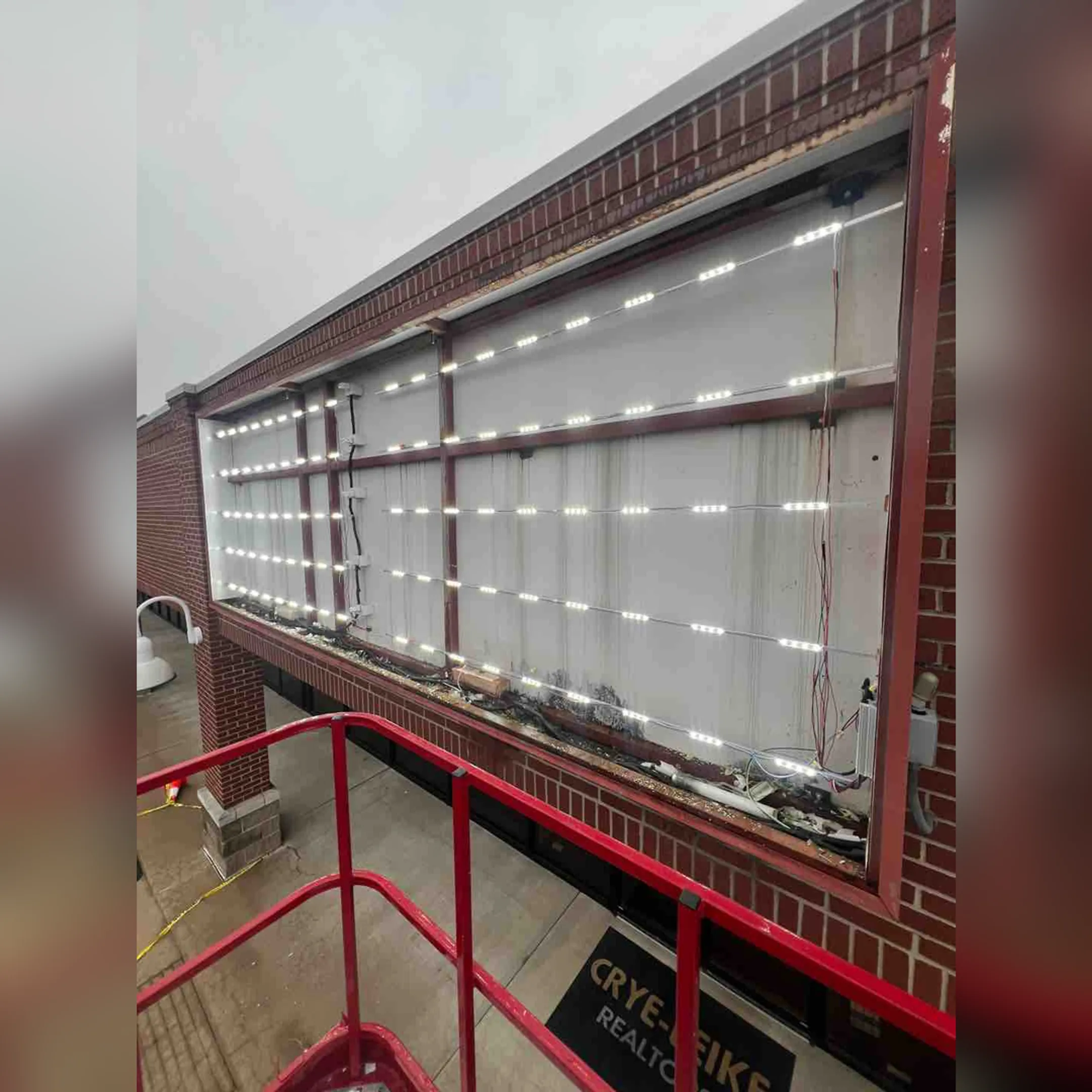 Technician testing emergency exit lighting