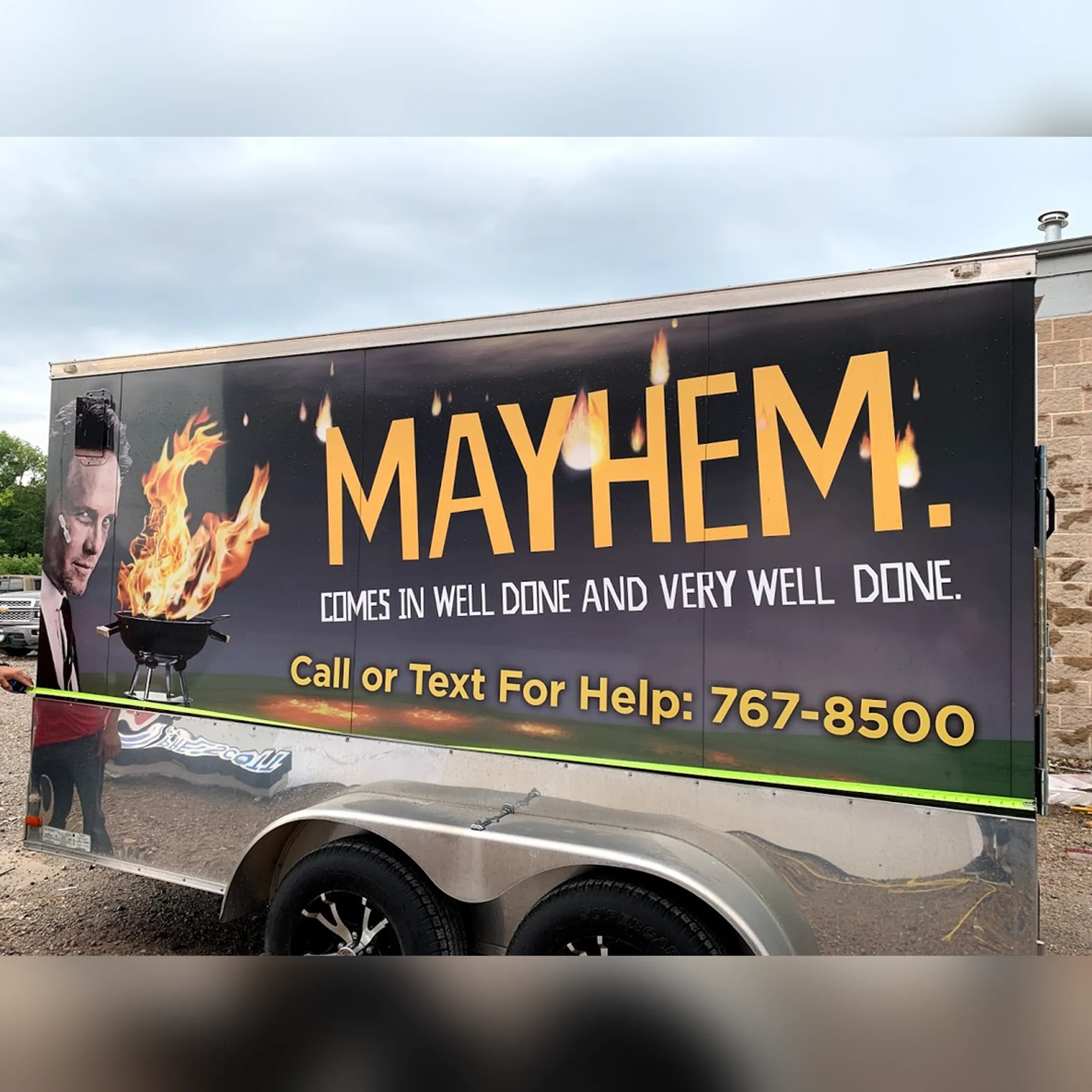 Designer reviewing vehicle wrap artwork before production