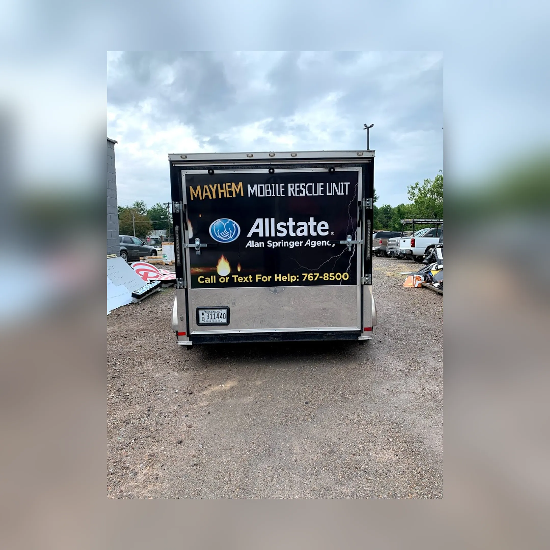 Vinyl installer applying graphics to a semi truck