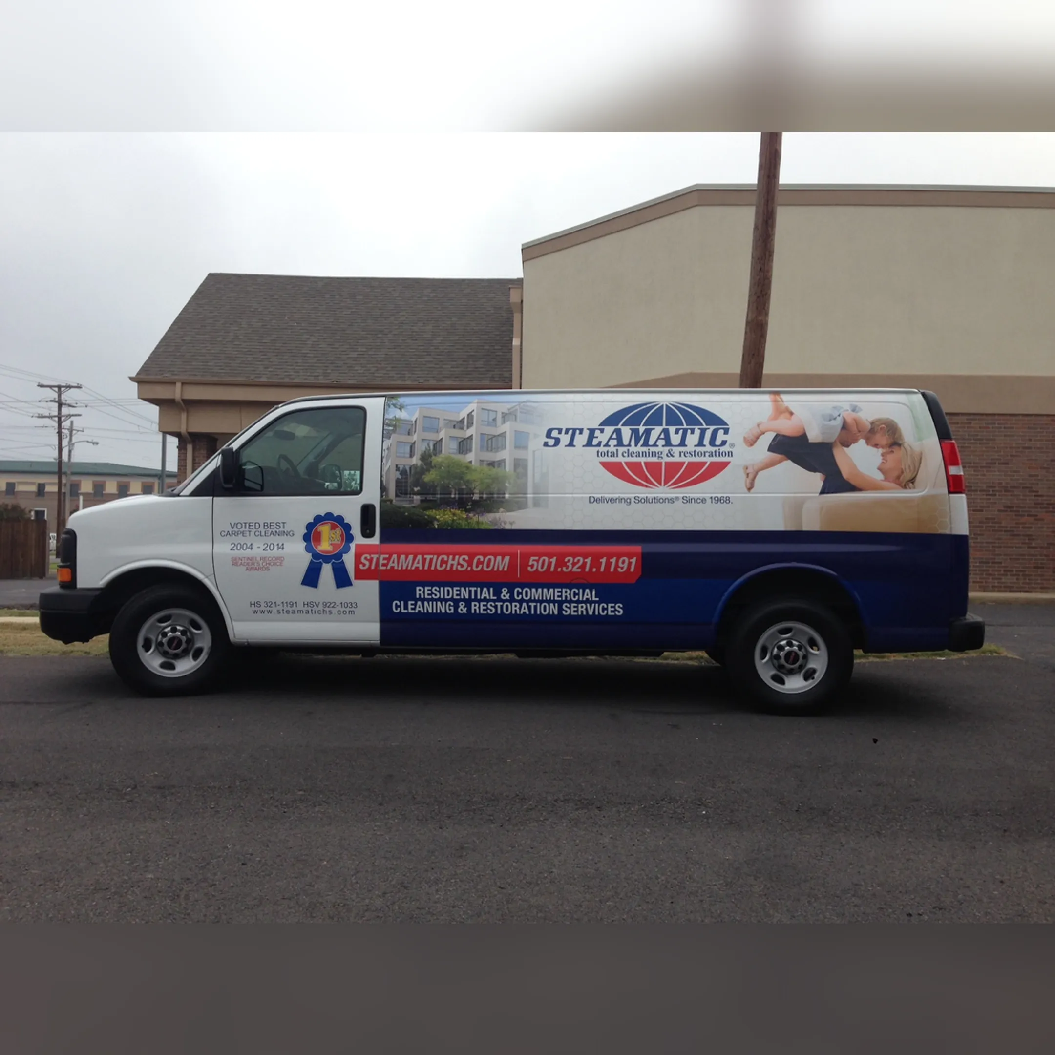 Vibrant food truck wrap with custom graphics being applied by a professional.