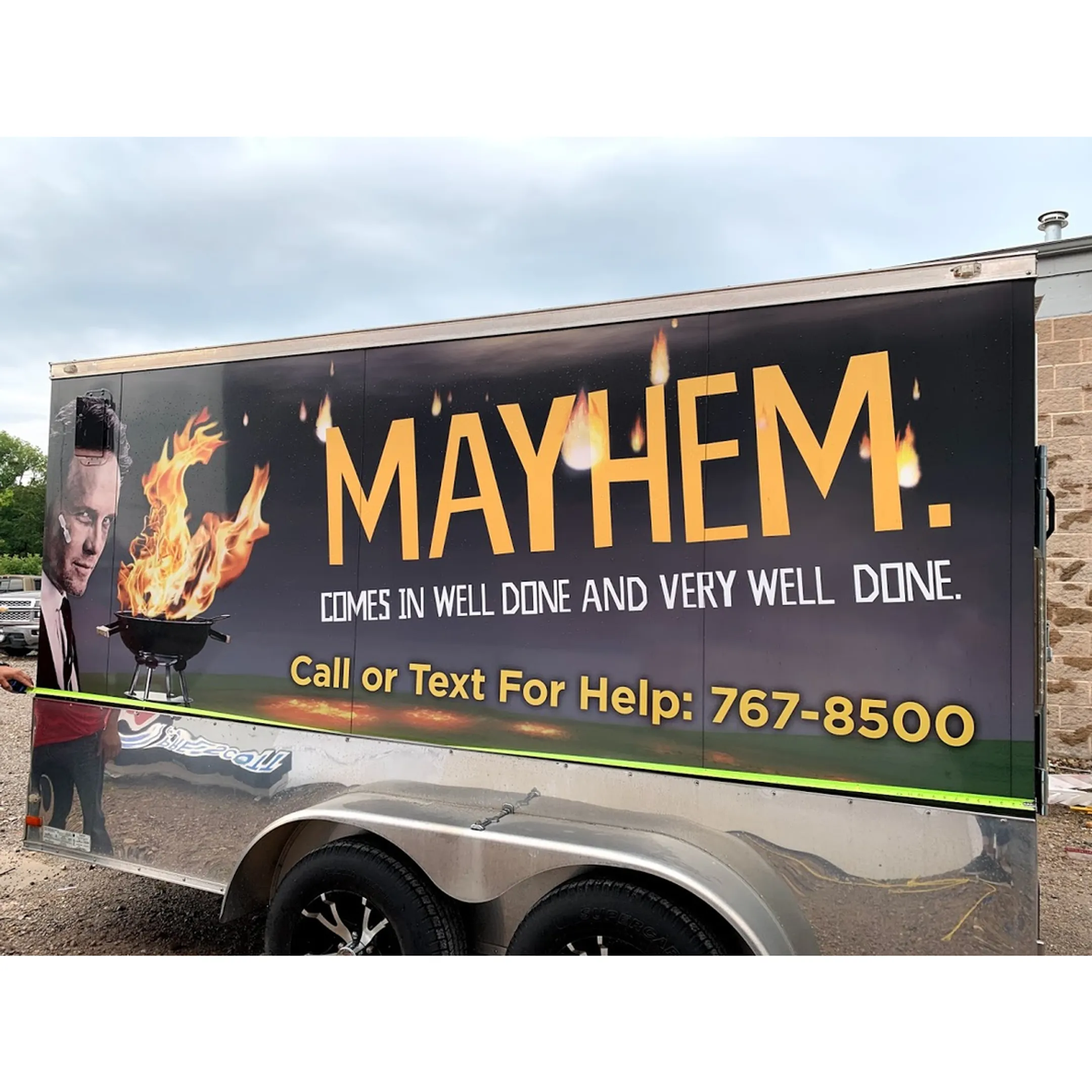 Designer reviewing vehicle wrap artwork before production