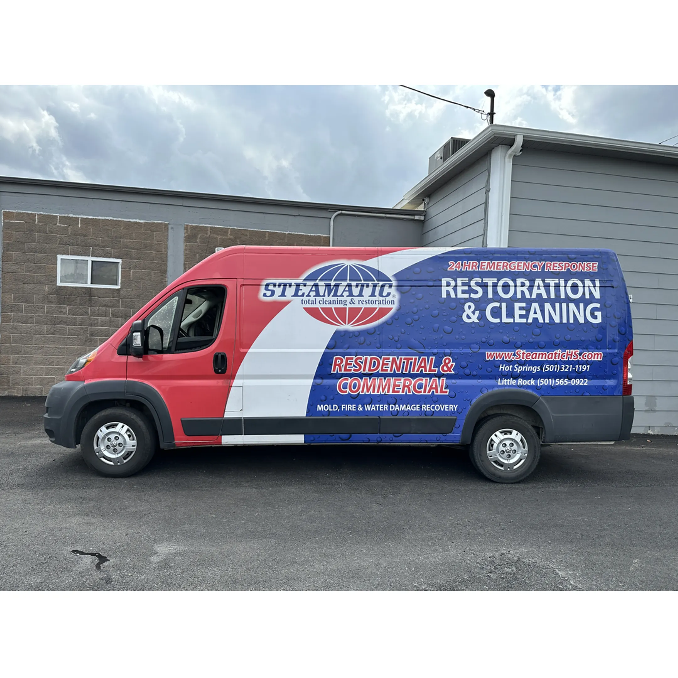 Custom vehicle wrap installation on a branded work van
