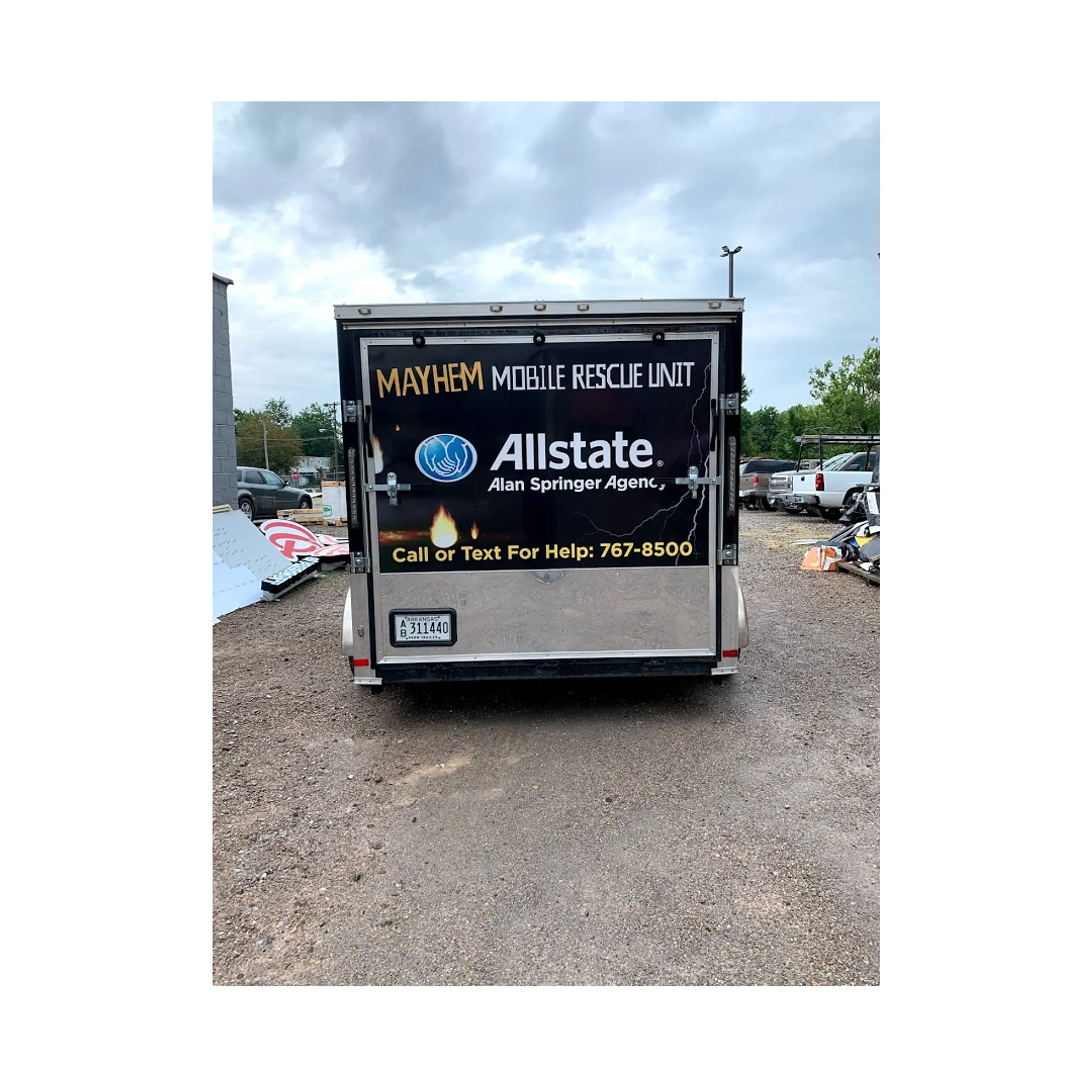 Vinyl installer applying graphics to a semi truck