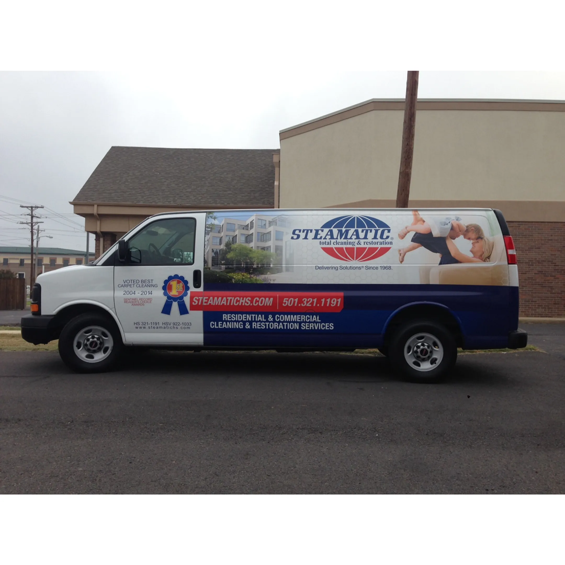 Vibrant food truck wrap with custom graphics being applied by a professional.