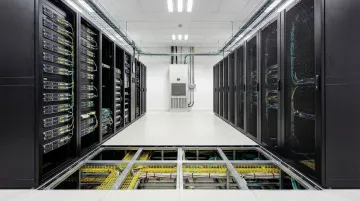 Modern data center interior showing server racks precision cooling units and raised flooring systems