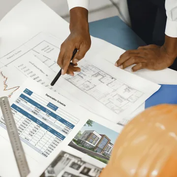 Cost segregation engineer reviewing assisted living facility blueprints and depreciation schedules