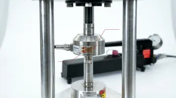 Industrial strain gauge load cell installed in structural fatigue testing rig